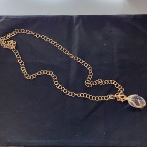 Gold tone serpent necklace